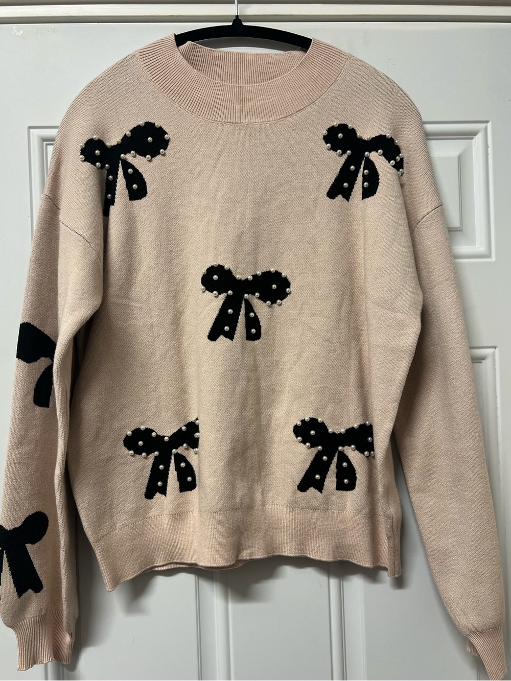 Artsel taupe sweater with black bow and pearl detail size large